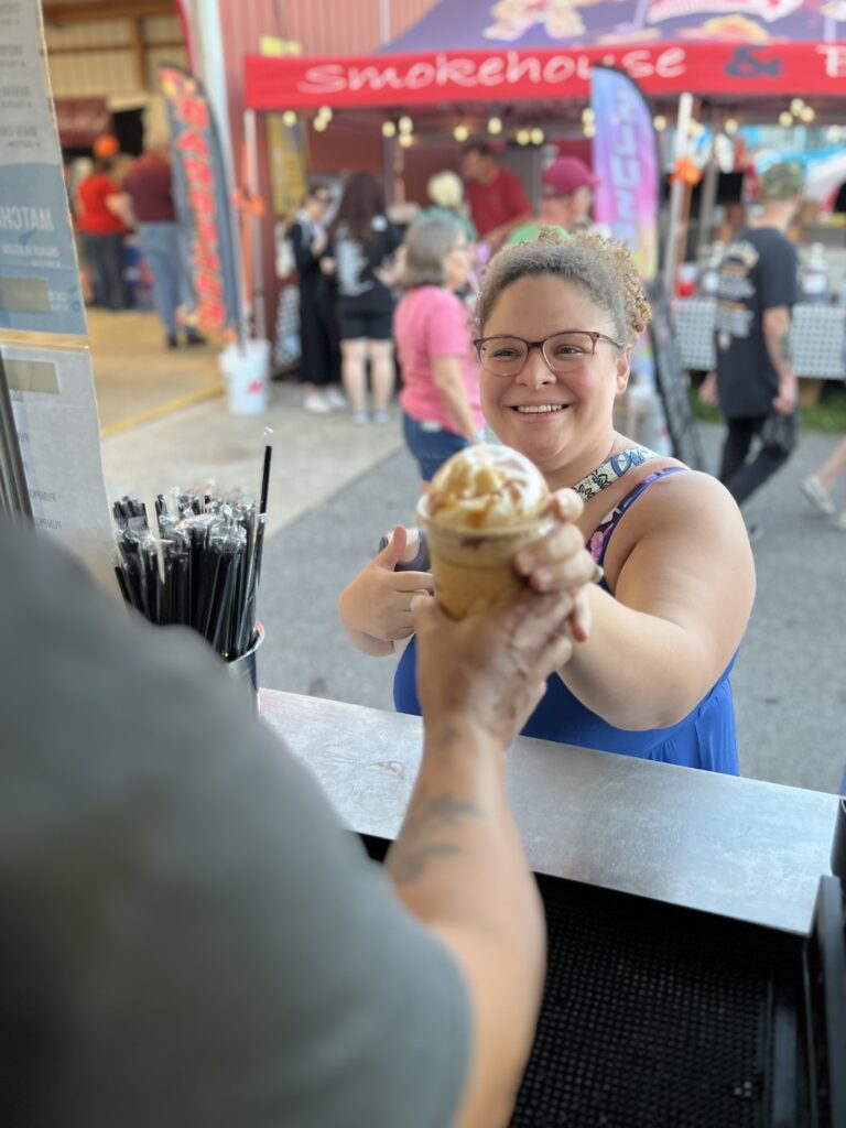 Customer receiving their drink from the Mocha Motion Coffee truck during the Elizabethtown Fair.